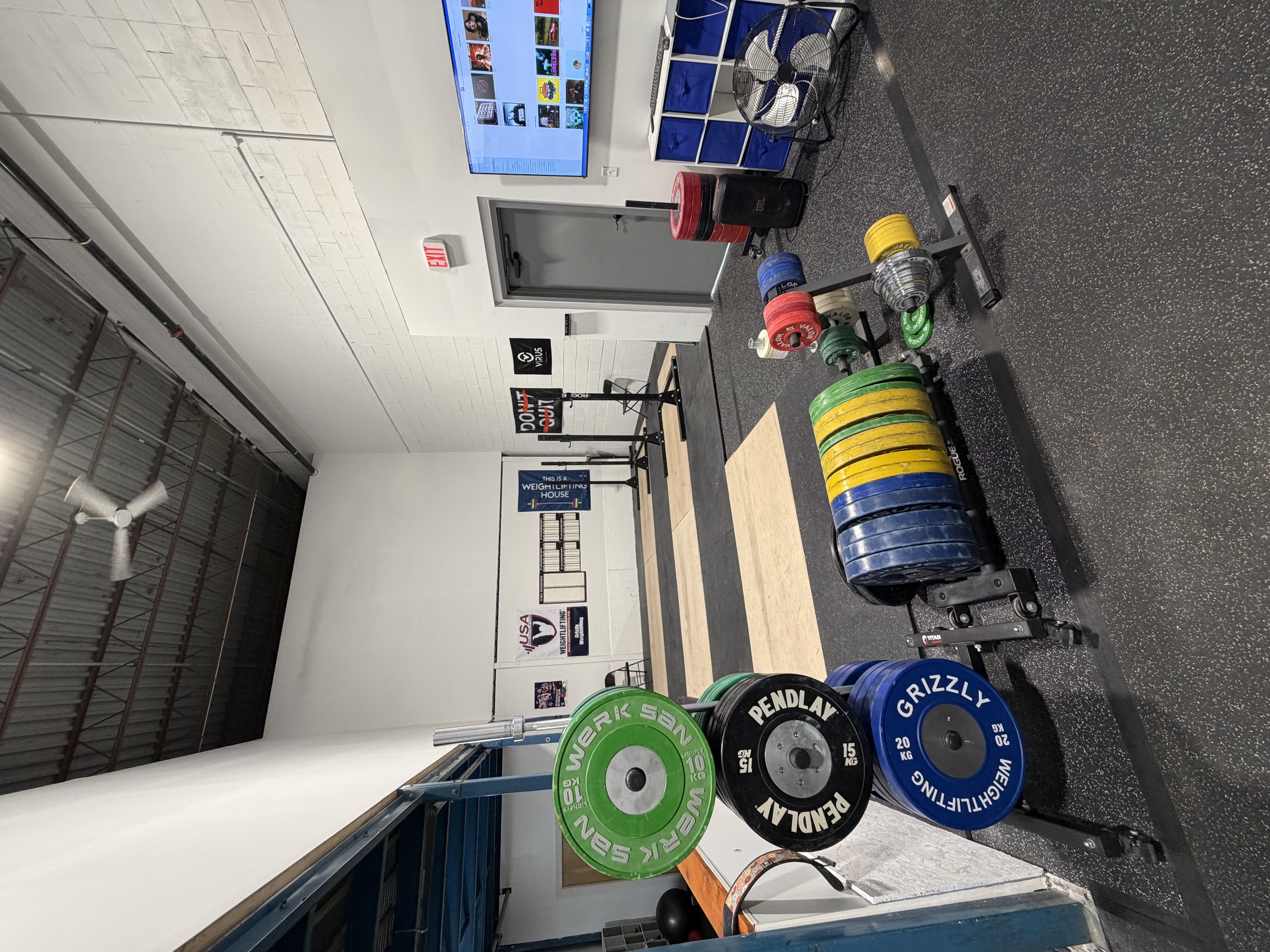 Olympic weightlifting platform and barbells at Grizzly Weightlifting